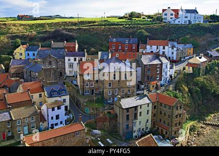 Taken from a high location, to capture an aerial view of the fishing village cottages, within the picturesque North Yorkshire location, of Staithes. Stock Photo