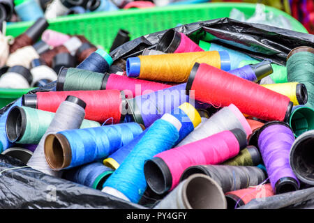 Basket of reels of multi-colored thread used for flying kites on All Saints Day in Guatemala, Central America. Stock Photo