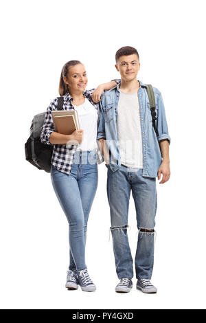 Full length portraits of a male and female student standing and smiling isolated on white background Stock Photo