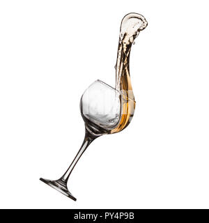 Wine splashing out of glass. Liquid in motion swirled high into the air against a white background. Studio shot. Conceptual: celebrating, celebration. Stock Photo