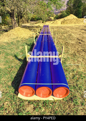 Plastic tubes ready for assembly into city water supply system. Repairing of leakness or accident. Stock Photo