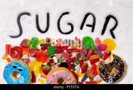 Colorful selection of different child sweets candies and treats with ...