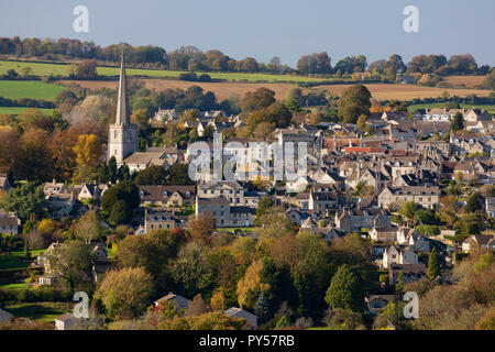 View over Cotswold town of Painswick with St Mary's Parish Church in autumn afternoon sunlight, Painswick, Cotswolds, Gloucestershire, England, United