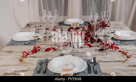white plate table setting on wooden table. Stock Photo