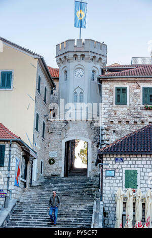 Old gates of the city and the Sakhat Kula tower with the clock in Herceg Novi, Montenegro Stock Photo