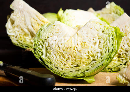 Sliced raw cabbage on a wooden table Stock Photo