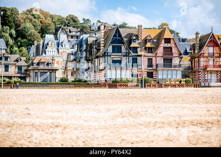 View on the cooastline with sandy beach and luxury buildings in Trouville, famous french town in Normandy Stock Photo