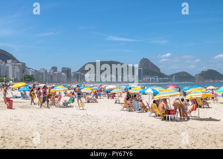 Copacabana Beach with Sugar Loaf Mountain on Background - Rio de Janeiro, Brazil Stock Photo