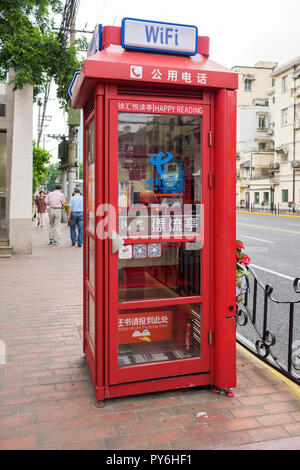 One of the telephone boxes in Shanghai, China, Asia now used both as a book-lending station and a wifi hotspot Stock Photo