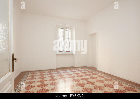 Open door and white, empty room in renovated apartment Stock Photo