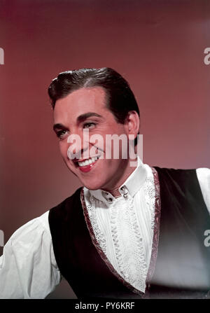 Mariano Eusebio González y García (13 August 1914 – 14 July 1970), also known as Luis Mariano, was a popular tenor of Spanish origin who achieved celebrity in 1946 with ' La belle de Cadix ' (' The Beautiful Lady of Cadix ') an operetta by Francis Lopez. He appeared in the 1954 film Adventures of the Barber of Seville and Le Chanteur de Mexico (1957) and became popular in France as well as his native Spain. Stock Photo