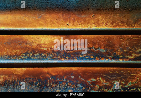 Rust on a cast iron piece of metal with beautiful colours Stock Photo