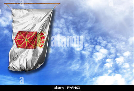 Flag of Navarra coat of arms. Vertical flag, against blue sky with place for your text Stock Photo