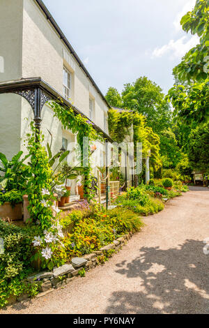 Elegant architecture and colourful planting outside Lady Anne's House at the RHS Garden Rosemoor, Devon, England, UK Stock Photo