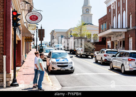 Lexington, USA - April 18, 2018: Historic downtown town city in Virginia countryside Shenandoah mountain village, signs for book store, people walking Stock Photo