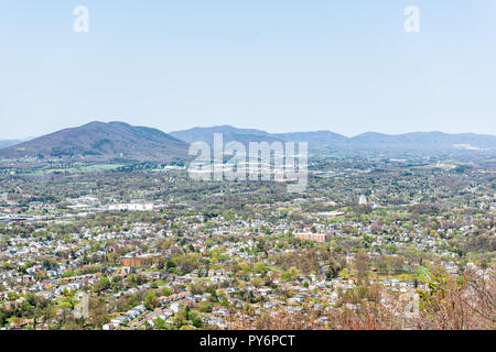 Roanoke, USA - April 18, 2018: Aerial Cityscape Skyline Panoramic panorama view of city in Virginia during spring with mountains, during sunny day Stock Photo