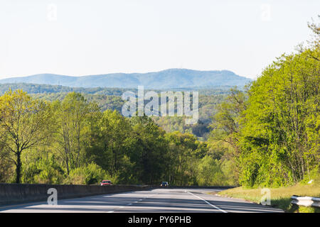 Smoky Mountains near Asheville, North Carolina at Tennessee border during sunny spring day, sky, green trees, highway road Stock Photo