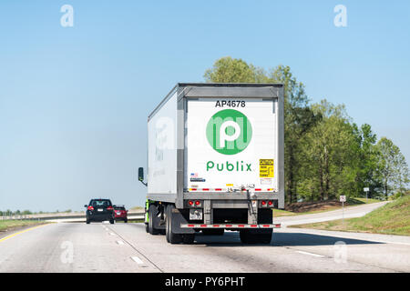 Atlanta, USA - April 20, 2018: Back of green Publix grocery store delivery truck closeup on highway road with sign Stock Photo