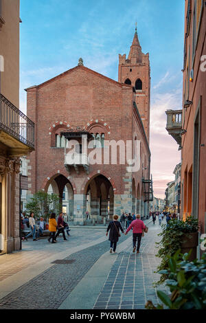 Monza, Italy - 07 October 2018: An old couple walks hand in hand through the city center, Monza, Italy Stock Photo
