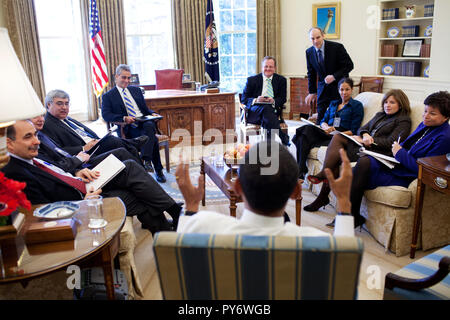 President Barack Obama meets with senior advisors in the Oval Office. 2/2/09. Official White House Photo by Pete Souza Stock Photo