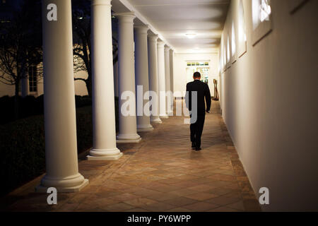 President Barack Obama walks along along the Colonnade toward the Oval Office. 2/26/09.  Official White House Photo by Pete Souza Stock Photo