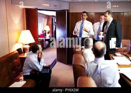 President Barack Obama meets with staff aboard Air Force One during their flight April 3, 2009, from Stansted Airport in Essex, England, en route to Strasbourg, France.. Official White House Photo by Pete Souza Stock Photo