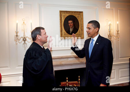 President Barack Obama is given the Oath of Office for a second time by Chief Justice John G. Roberts, Jr.  in the Map Room of the White House 1/21/09.  Official White House photo by Pete Souza Stock Photo