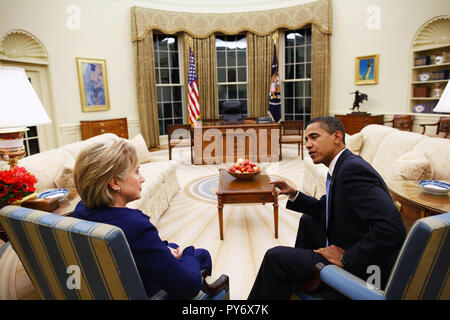 President Barack Obama meets with Secretary of State Hillary Clinton in the Oval Office shortly after she was confirmed and sworn in on Wednesday, Jan. 21, 2009.  Official White House Photo by Pete Souza Stock Photo