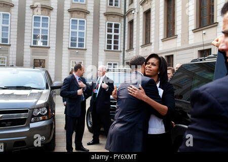 President Barack Obama and First Lady Michelle Obama embrace as they say goodbye April 5, 2009, at Prague Castle. Mrs. Obama assumes a separate schedule prior to her departure from the Czech Republic. Official White House Photo by Pete Souza Stock Photo