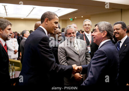 President Barack Obama greets Costa Rica President Oscar Arias during a reception at the Summit of the Americas in Port of Spain, Trinidad on April 17, 2009.  Official White House Photo by Pete Souza Stock Photo