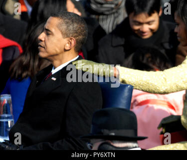 Michelle Obama gives President-elect Barack Obama support before the swearing-in ceremony at the U.S. Capitol in Washington, D.C., Jan. 20, 2009. DoD photo by Master Sgt. Cecilio Ricardo, U.S. Air Force Stock Photo