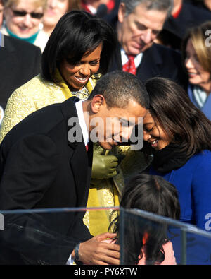 President Barack Obama gives a hug to Dallas nurse Nina Pham in the ...