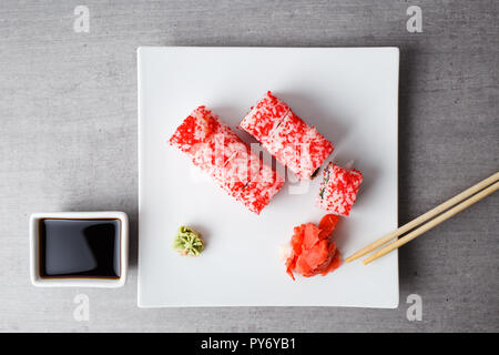 Philadelphia with caviar served in plate on grey table top view Stock Photo