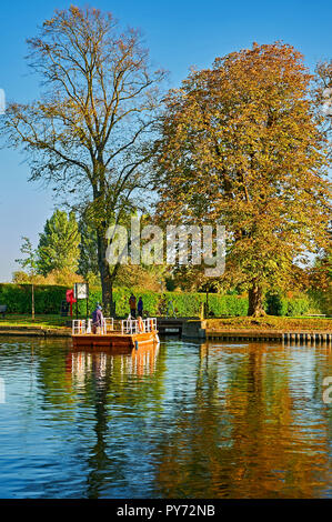 Stratford upon Avon, Warwickshire and the old chain ferry is crossing the River Avon on an autumnal afternoon Stock Photo