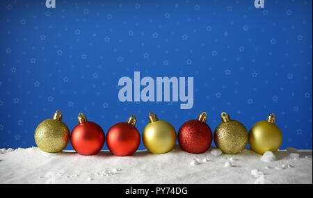 row of Christmas balls on the snow with blue sky background - closeup Stock Photo