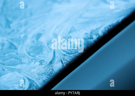 Frozen Windshield of a Seat in Winter Stock Photo