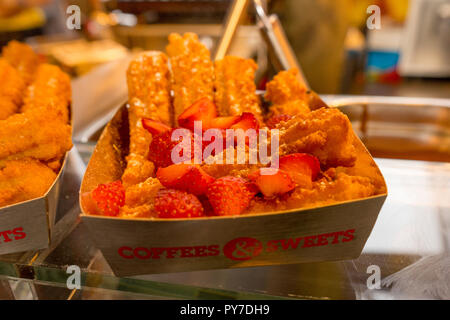 Rotterdam, Netherlands - 16 July, 2016: Churros with strawberry on display at Markthal in Roterdam Stock Photo