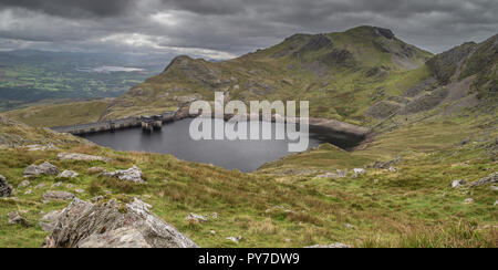 Stwlan Dam and the Moelwyn mountains near Blaenau Ffestiniog in Snowdonia. Stock Photo