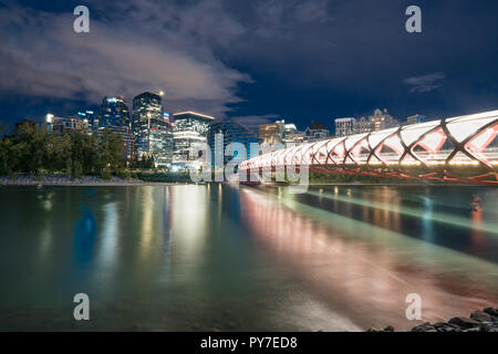 Skyline of the city Calgary, Alberta, Canada along the Bow River with Peace Bridge Stock Photo