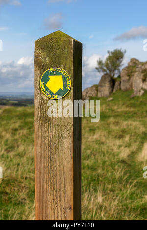 A wooden waymarker with a yellow arrow saying Four Circuit walks and Middleton Top, Derbyshire, England, UK Stock Photo