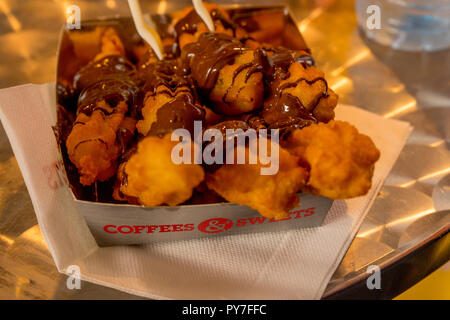 Rotterdam, Netherlands - 16 July, 2016: Churros with chocolate cream on display at Markthal in Roterdam Stock Photo