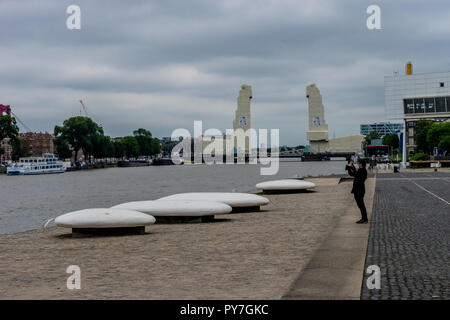 Rotterdam, Netherlands - 16 July, 2016:  Tourists taking a photo of the rotterdam city on the river bank Stock Photo