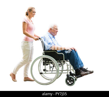 Happy Woman Assisting Her Disabled Father On Wheelchair Over White Background Stock Photo