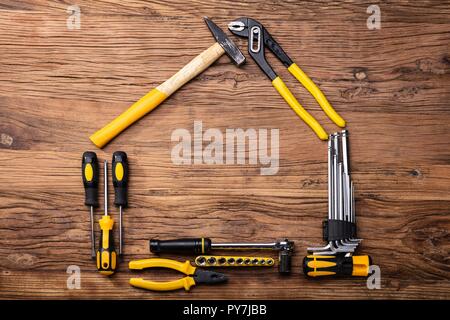 High Angle View Of Various Worktools On Wooden Background Stock Photo