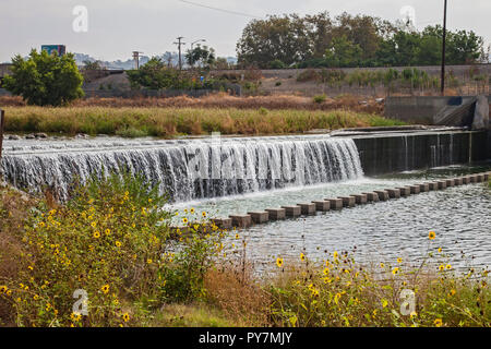 Tertiary-treated recycled water from the San Jose Creek Water Reclamation Plant is diverted to the unlined San Gabriel River for infiltration into the Stock Photo