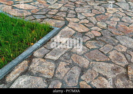 Fragment of cobblestone pavement Stock Photo