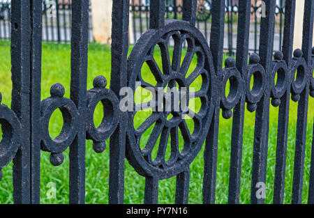 Fragment of an old cast-iron fence Stock Photo