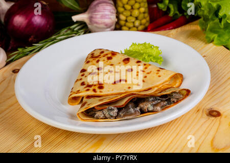 Stuffed tasty pancakes in the plate Stock Photo