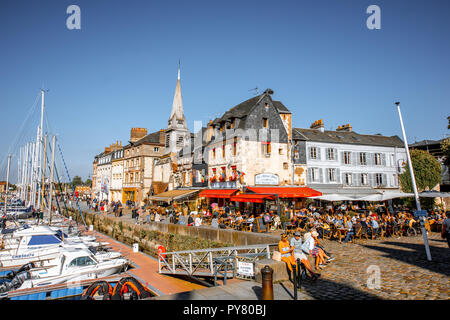 HONFLEUR, FRANCE - September 06, 2017: People at the cafes and restaurants near the harbour of the old town in Honfleur, Normandy region of France Stock Photo