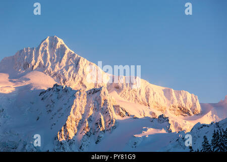 Mount Shuksan mountain peak summit in winter snow. Beautiful North Cascades National Park Pacific Northwest Washington State nature scene. Stock Photo